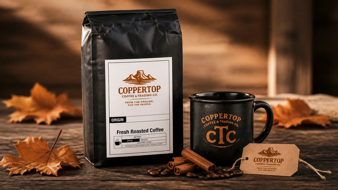 Coppertop Pumpkin Spice coffee bag on a reclaimed wood table with autumn leaves, coffee beans, a cTc mug, and Coppertop brand